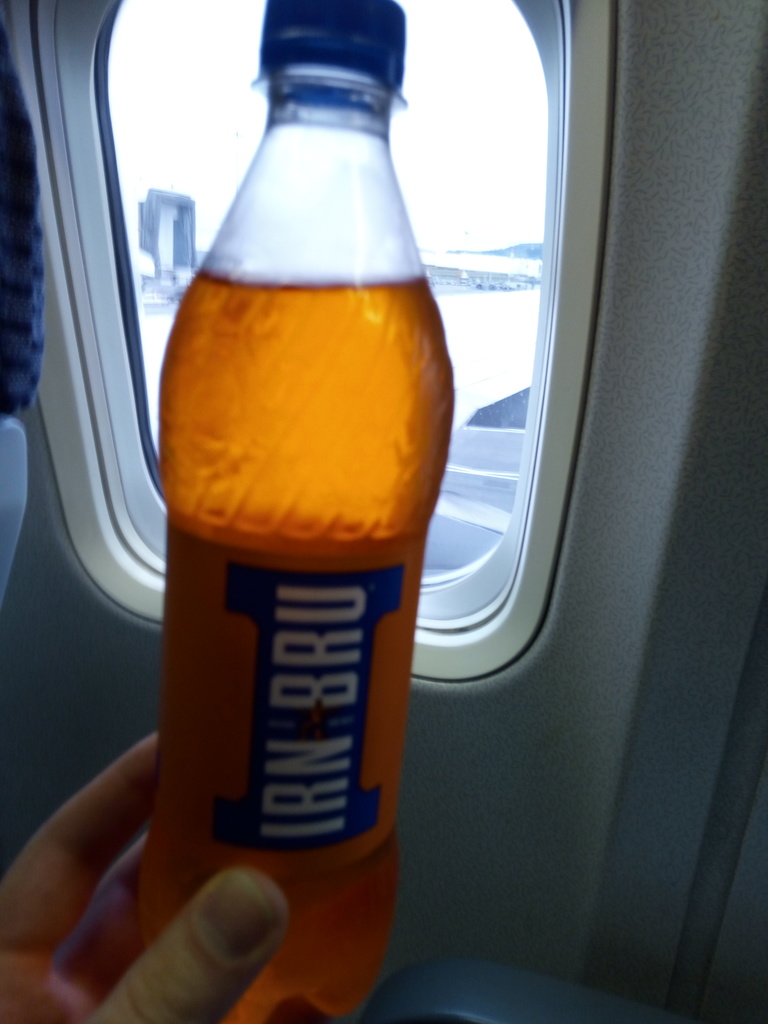 A bottle of Irn Bru in an aeroplane.